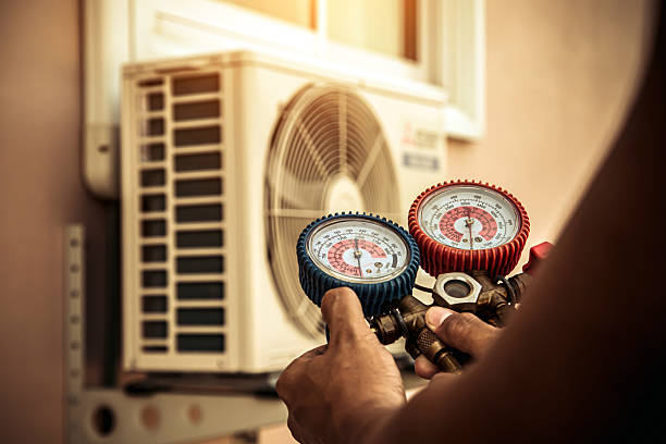 Professional Heat Pump Repair technician working in Alger, OH